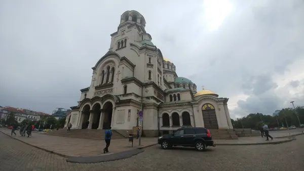 A domed cathedral beneath a cloudy Sofia sky