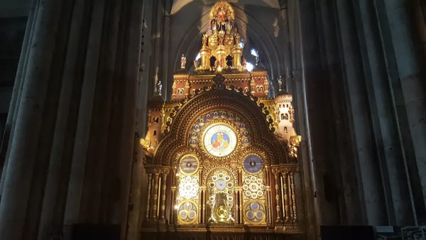 The ornate astronomical clock inside Beauvais Cathedral