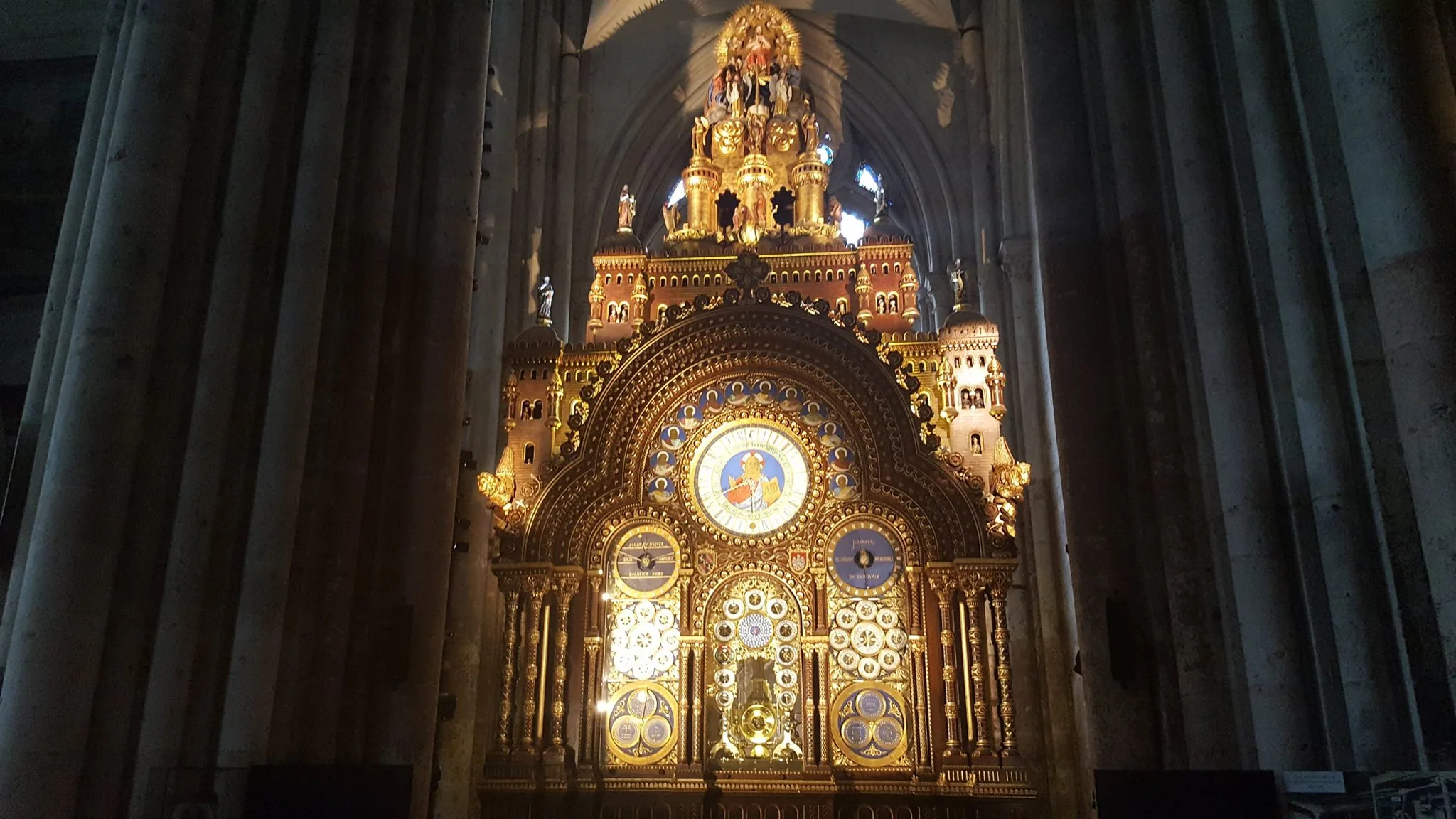 The ornate astronomical clock inside Beauvais Cathedral
