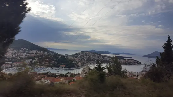 An elevated view across a Croatian harbour and surrounding hills