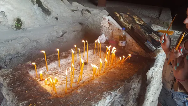 Lit candles in a stone recess