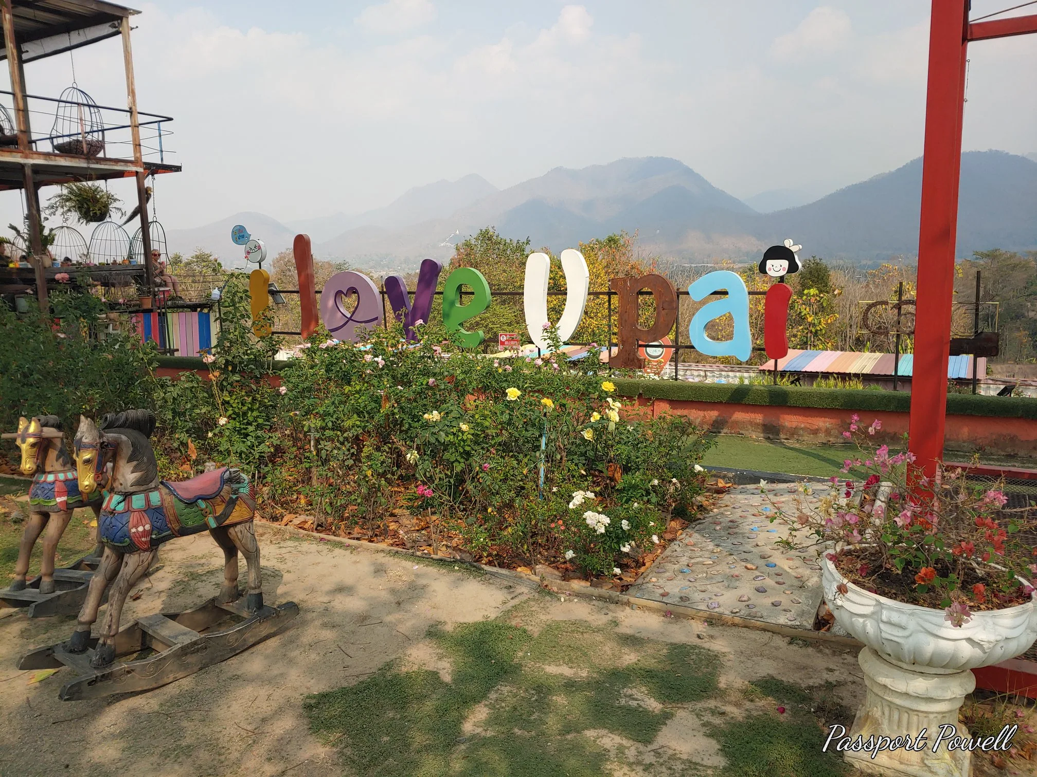 Colourful Pai lettering with mountains behind