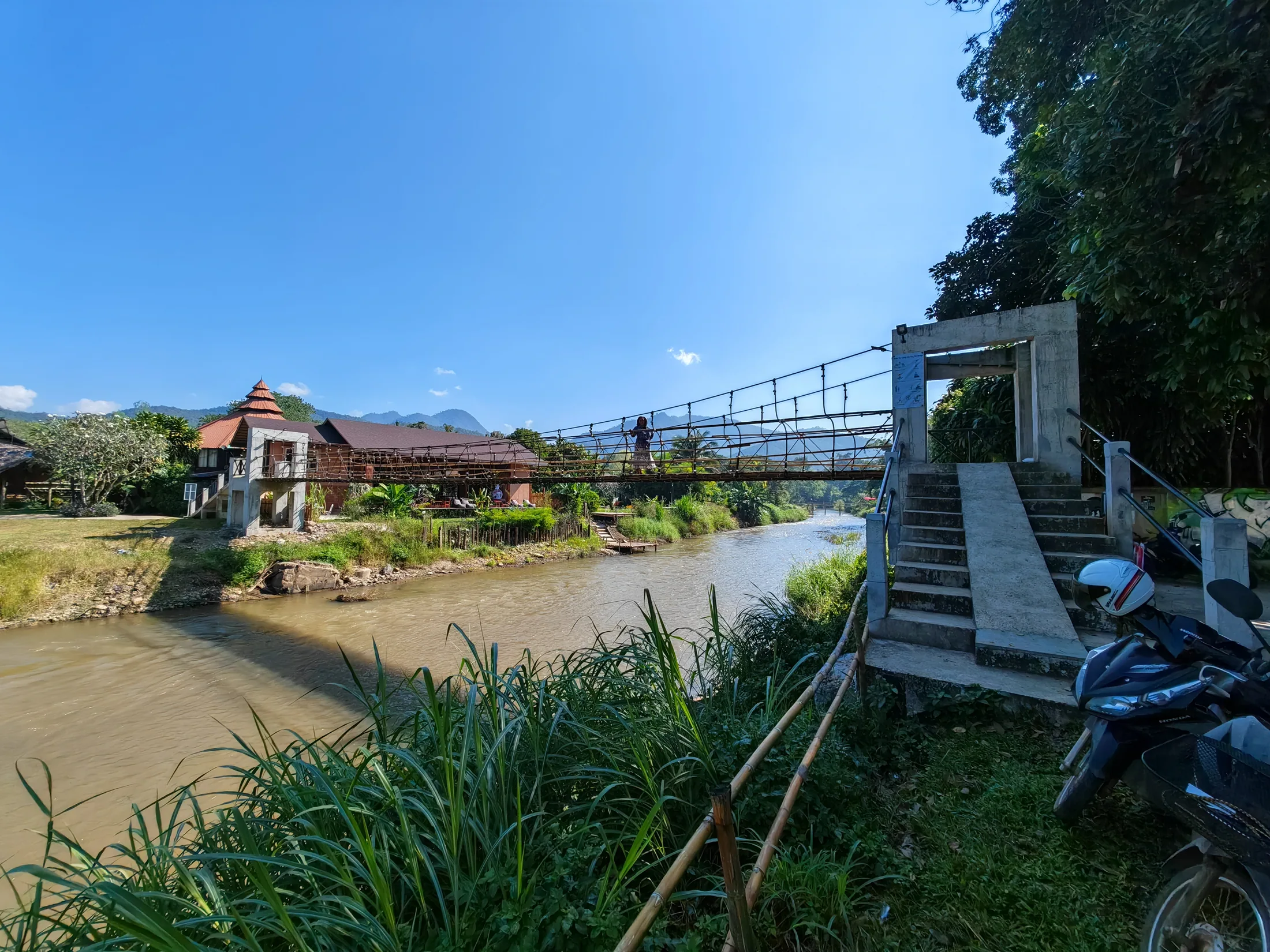 A pedestrian bridge crossing the river in Pai