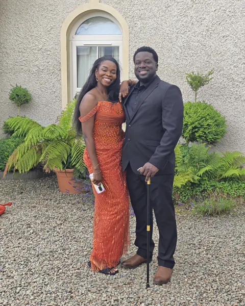 Two travellers dressed for a celebration during the Enniskillen visit
