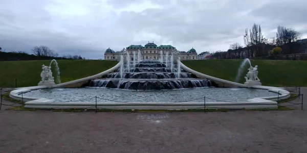 A broad cascade and sculptures in the palace gardens