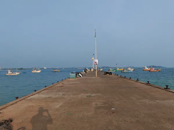 Fishing boats beside a jetty in Mirissa