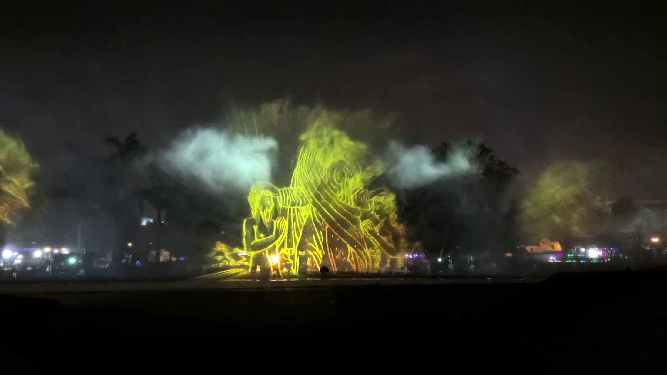 Bright images projected through an illuminated fountain in Lima