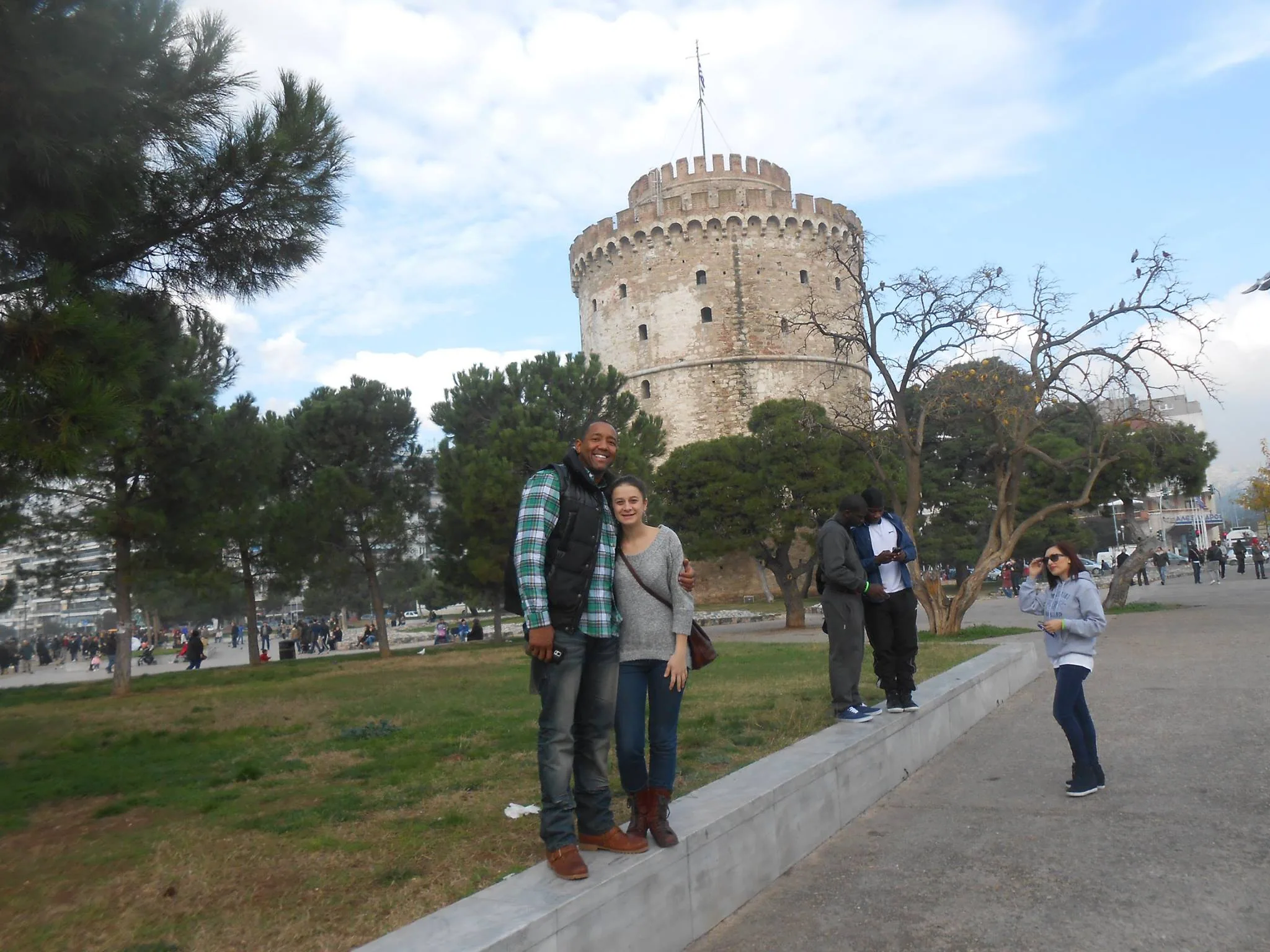 Travellers beside the White Tower and its surrounding park
