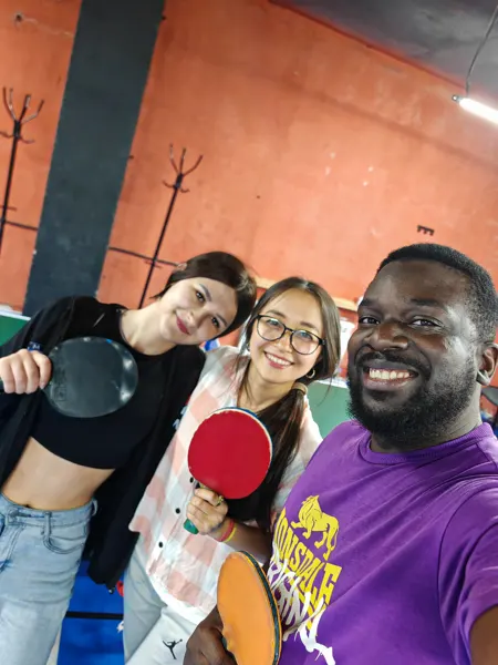 Travellers playing table tennis during their Astana visit
