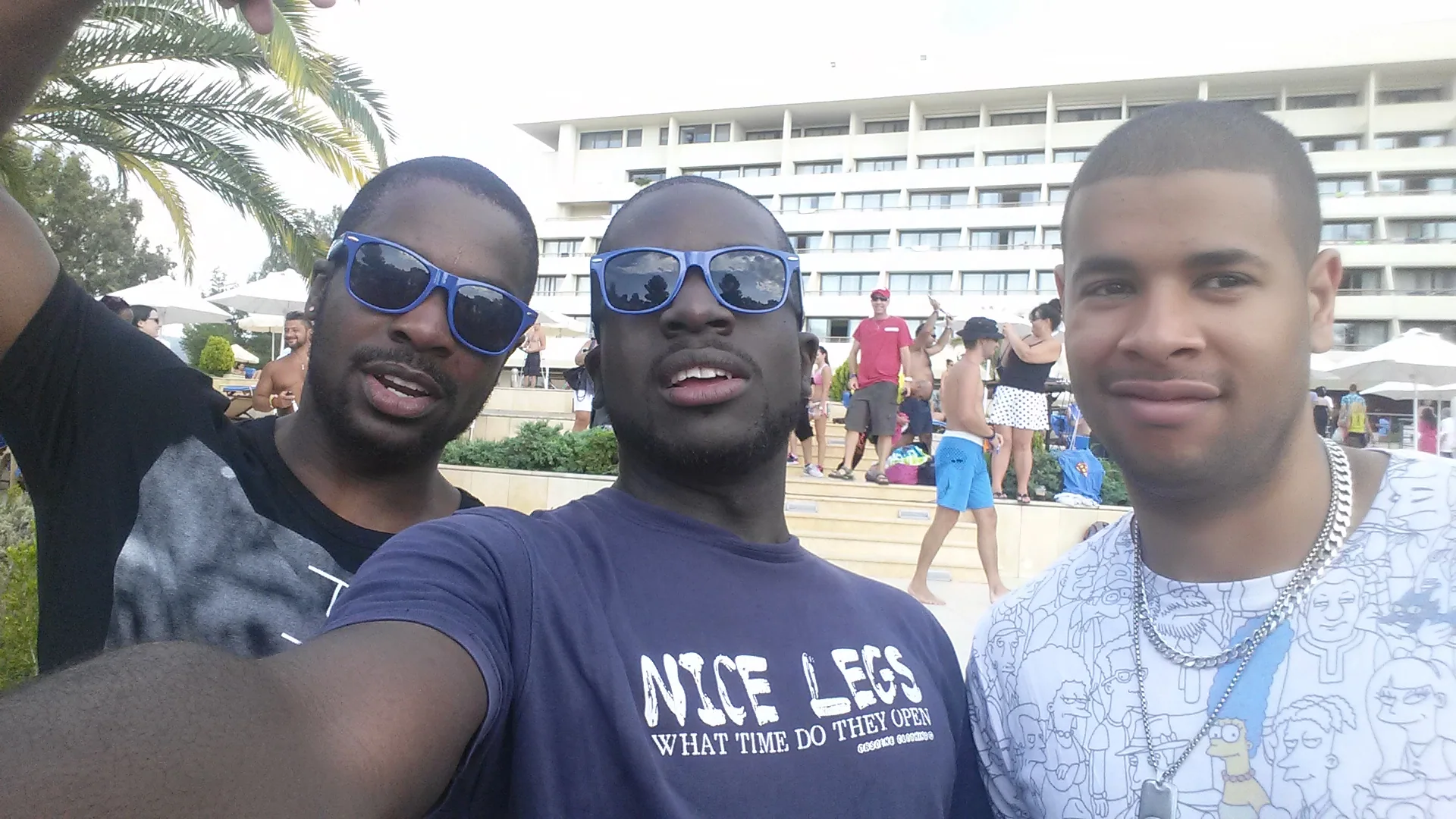 Travellers together outside a seaside hotel