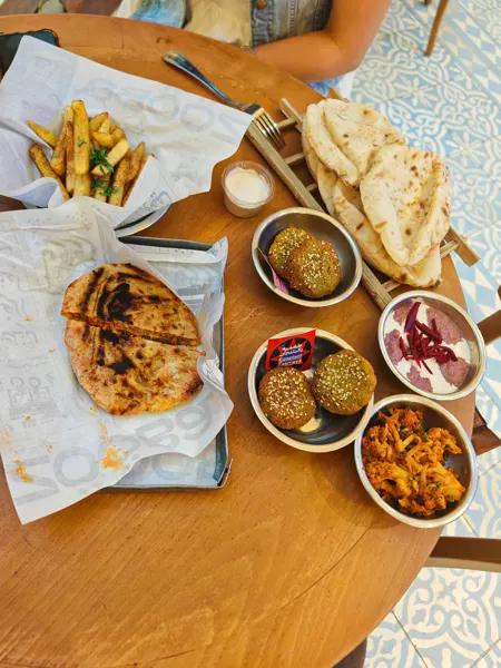 A shared meal of breads and small dishes in Cairo