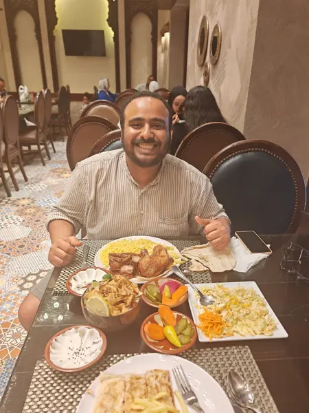 A traveller enjoying a shared meal in Alexandria