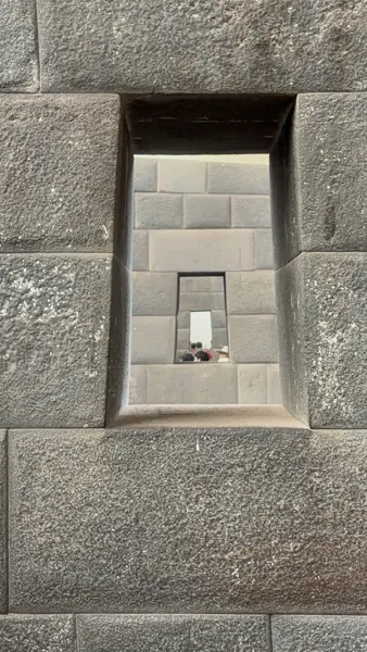 Carefully fitted stonework and a recessed opening in the Cusco region