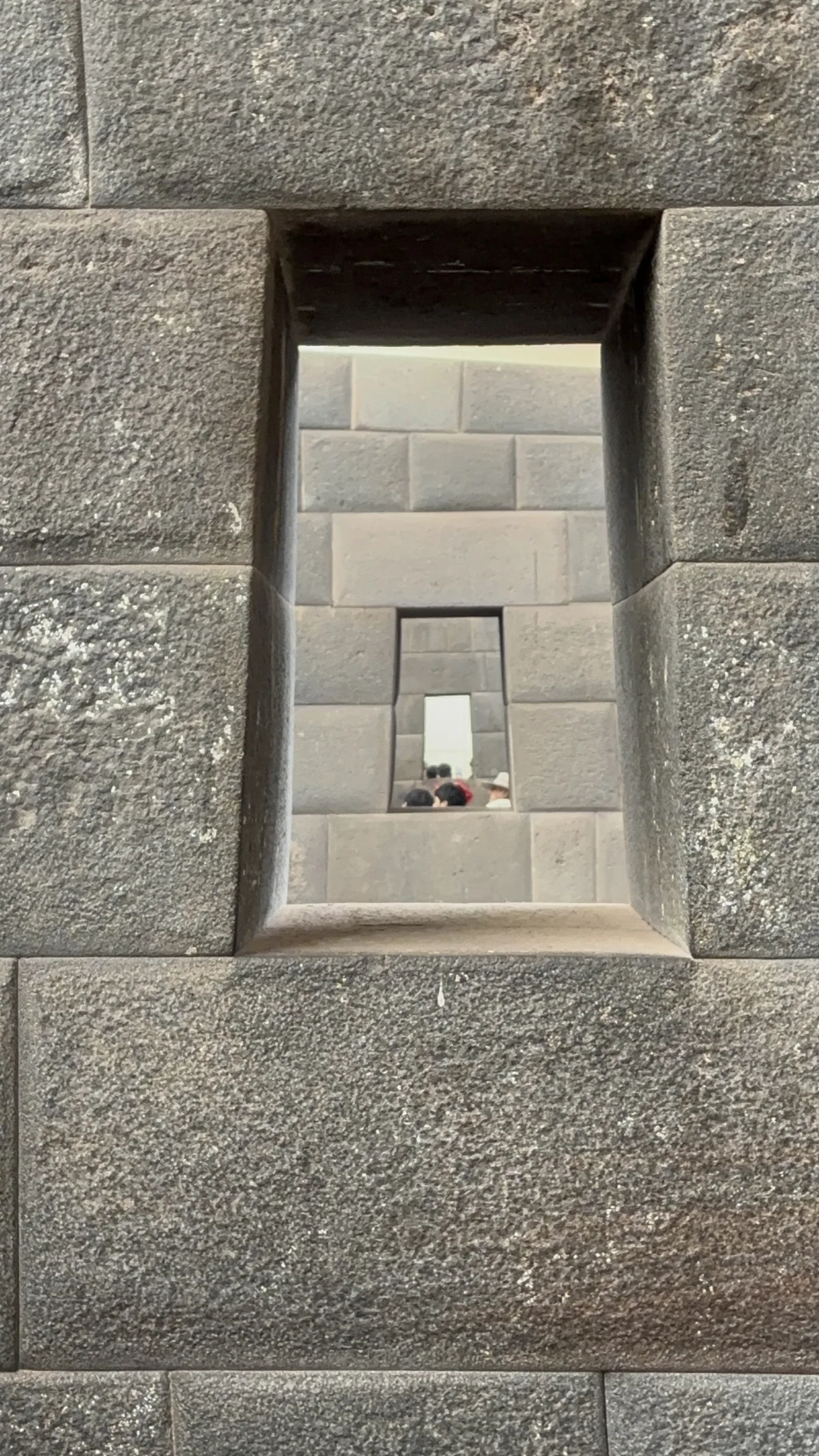 Carefully fitted stonework and a recessed opening in the Cusco region