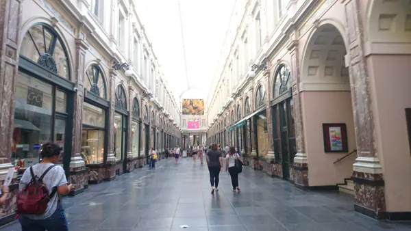 A bright covered shopping arcade in Brussels