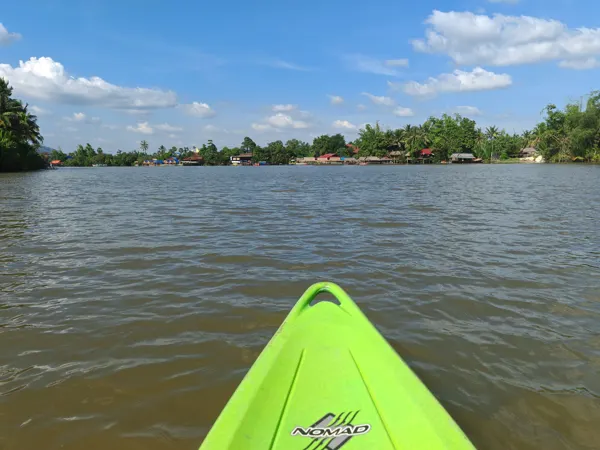 The bow of a kayak on the river near Kampot