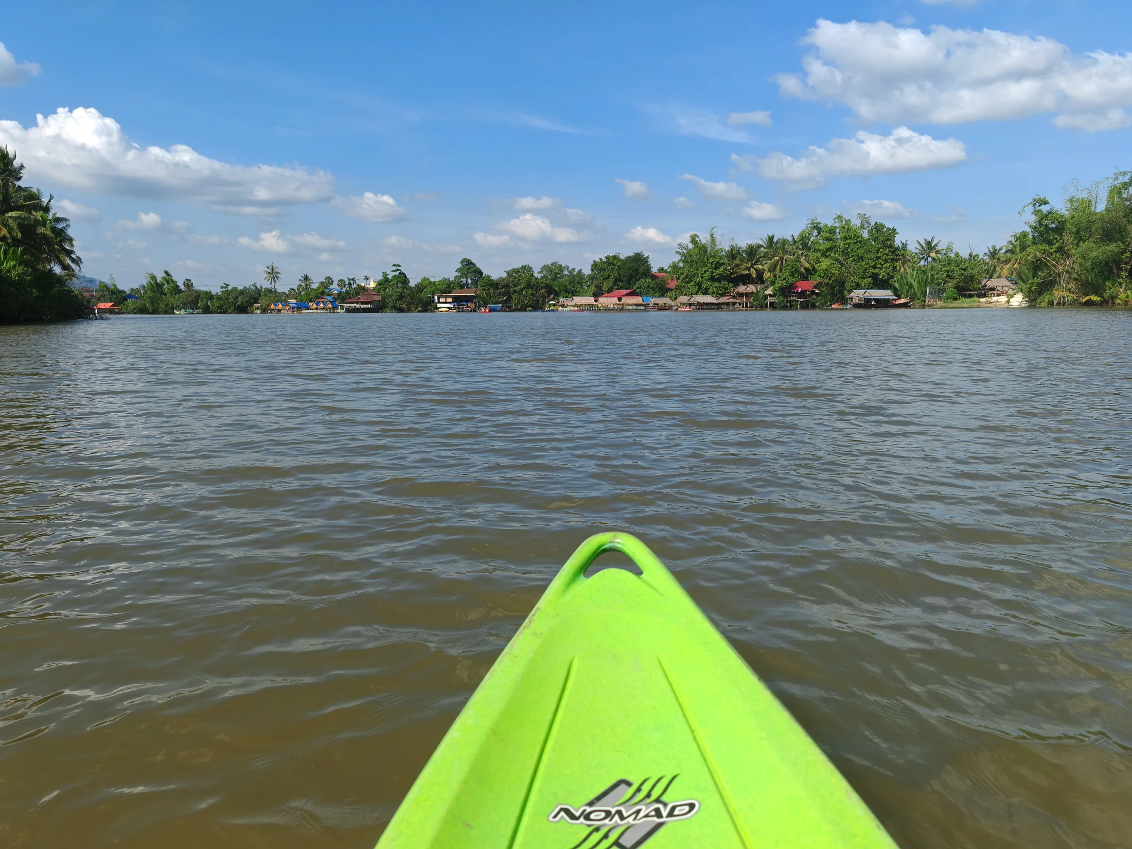 The bow of a kayak on the river near Kampot