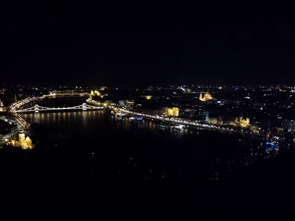 Illuminated bridges and buildings beside the Danube at night