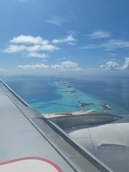 Turquoise Maldivian atolls seen from an aircraft window