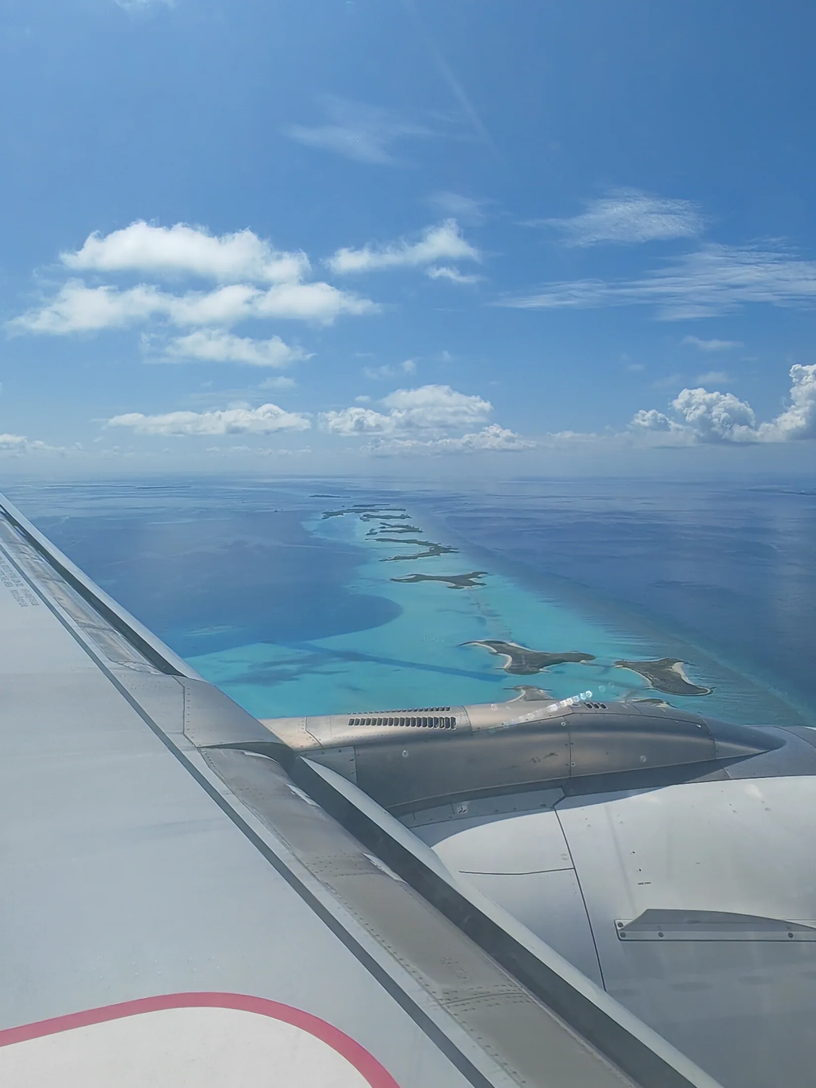 Turquoise Maldivian atolls seen from an aircraft window