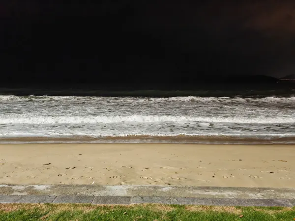 Waves breaking on Nha Trang beach after dark