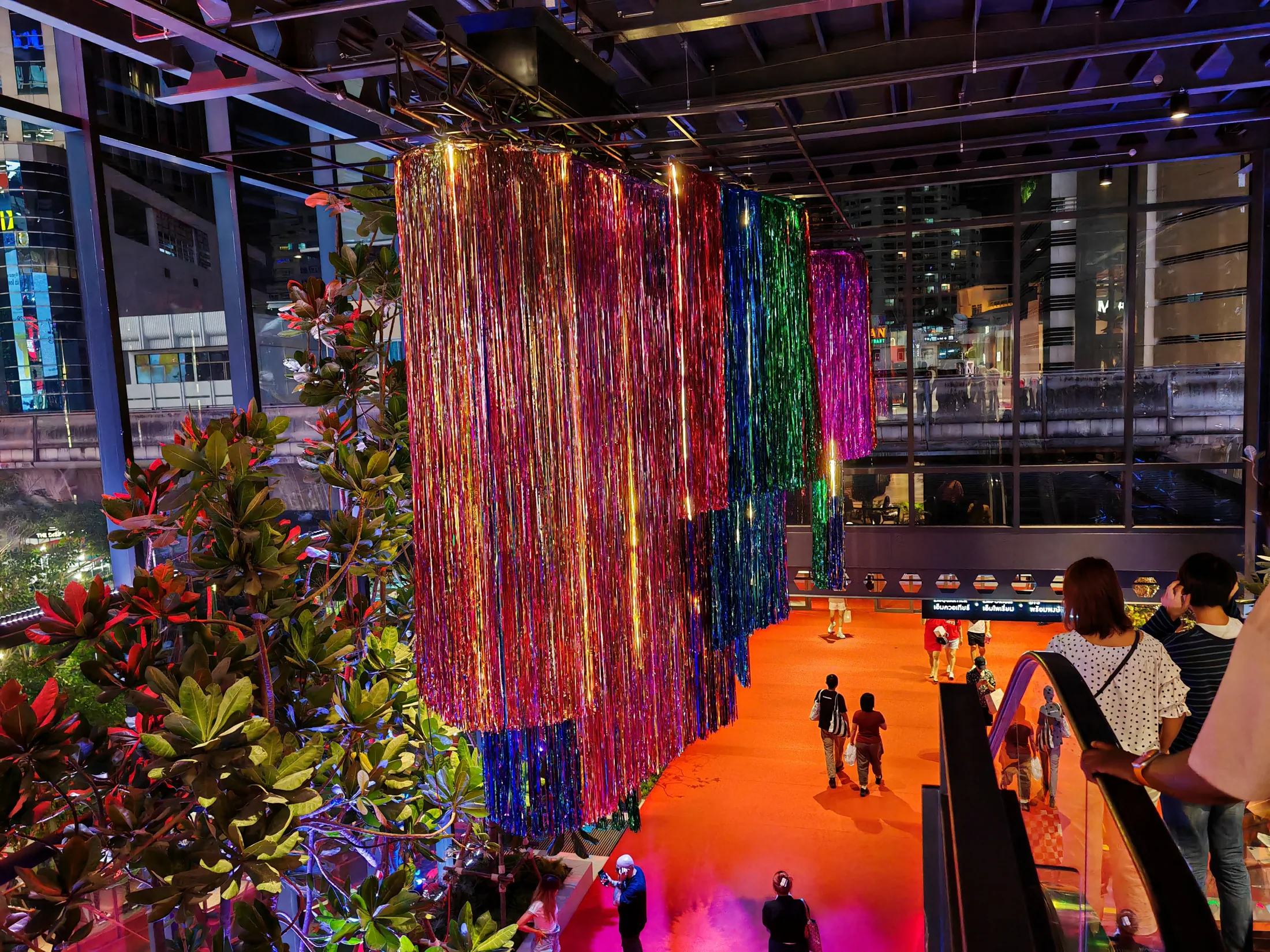 A colourful suspended art installation inside a Bangkok shopping centre